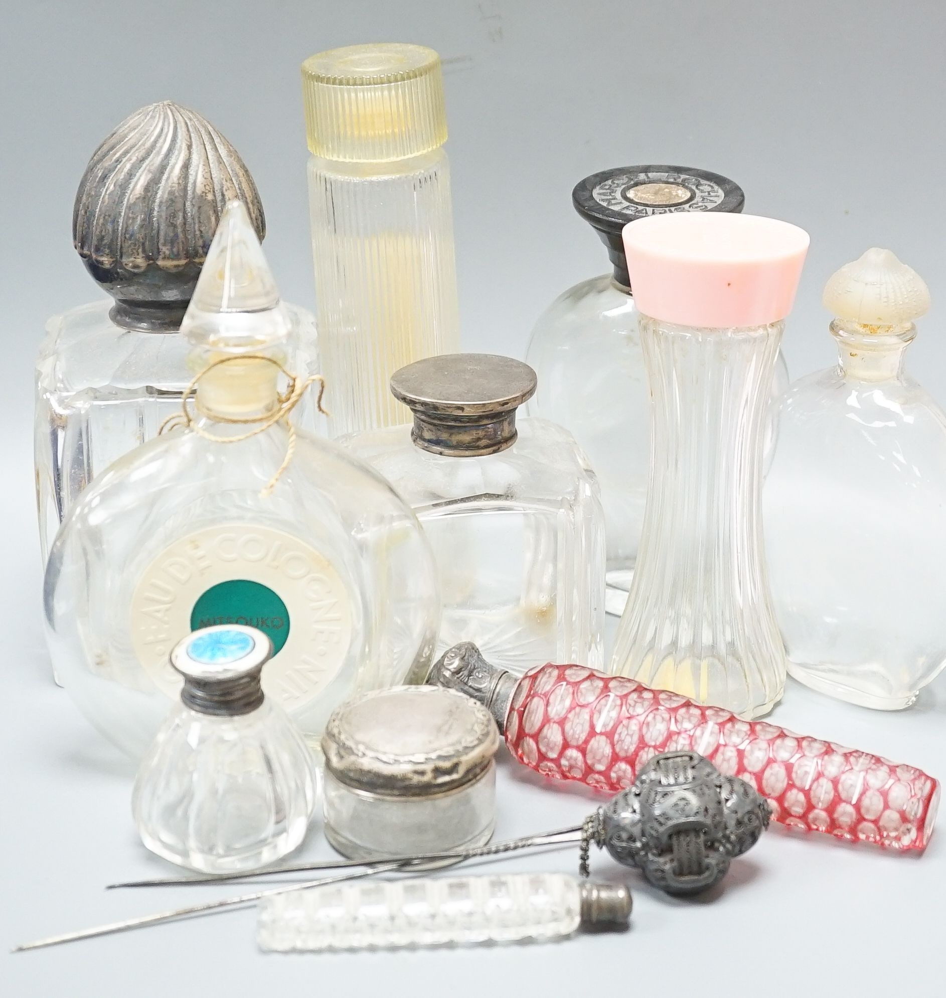 Various silver mounted glass toilet jars, scent bottles, etc, Largest item, 16 cms high.